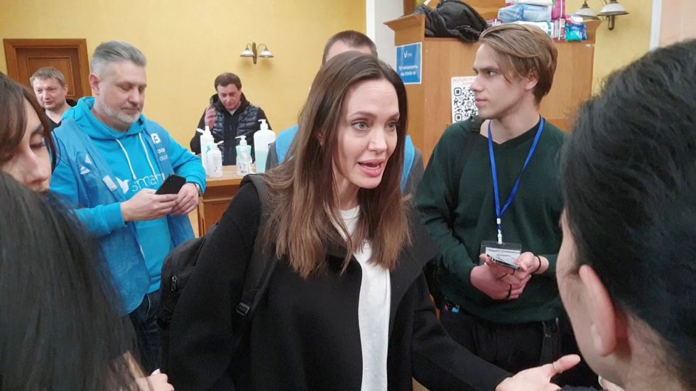 us actor and unhcr special envoy angelina jolie speaks while meeting with volunteers during a visit to lvivs main railway station, amid russias invasion of ukraine april 30, 2022 in this image obtained from handout video ukrzaliznytsiahandout via reuters attention editors   this image has been provided by a third party mandatory credit