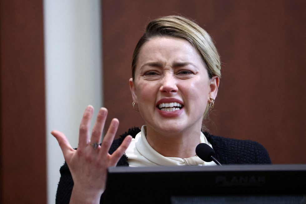 actor amber heard reacts on the stand in the courtroom at fairfax county circuit court during a defamation case against her by ex husband, actor johnny depp, in fairfax, virginia, us, may 5, 2022 jim lo scalzopool via reuters     tpx images of the day