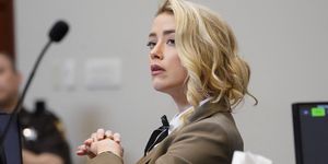 actor amber heard listens in the courtroom during actor and her ex husband johnny depps defamation case against her, in the courtroom at the fairfax county circuit courthouse in fairfax, virginia, us, may 23, 2022 steve helberpool via reuters