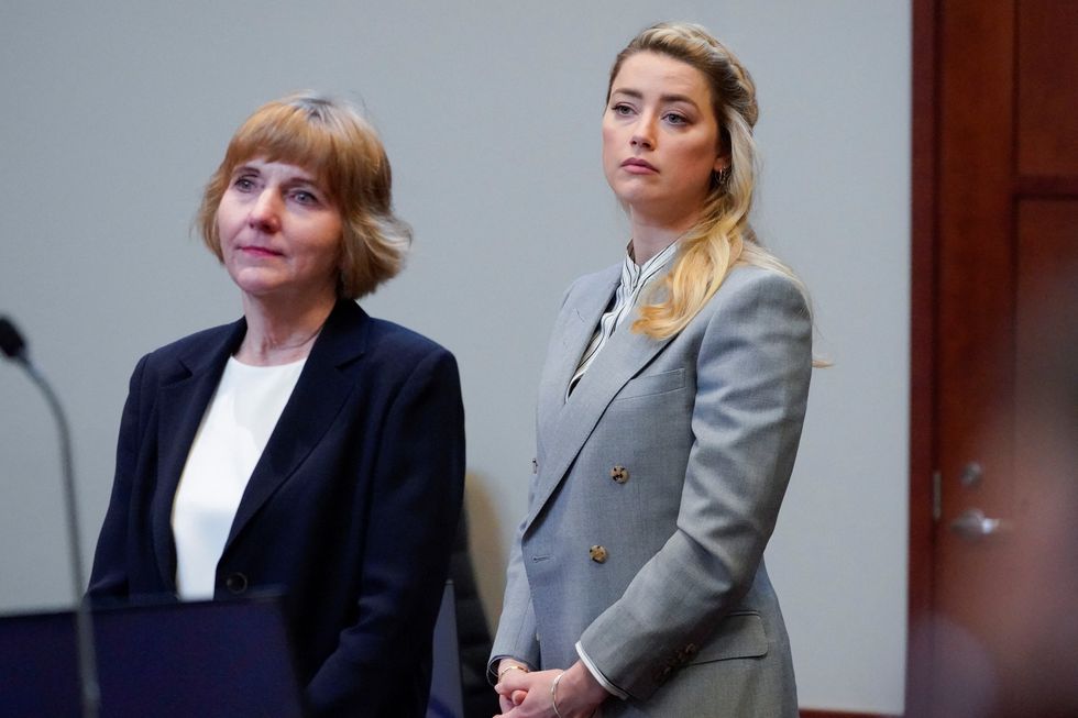 actor amber heard stands with her attorney elaine bredehoft in the courtroom during her ex husband johnny depps defamation case against her at the fairfax county circuit courthouse in fairfax, virginia, us, may 27, 2022 steve helberpool via reuters