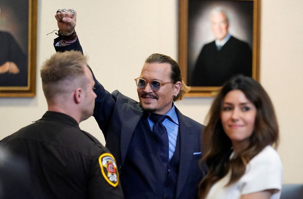 actor johnny depp gestures to spectators in court after closing arguments during his defamation case against ex wife amber heard, in the courtroom at the fairfax county circuit courthouse in fairfax, virginia, us, may 27, 2022 steve helberpool via reuters
     tpx images of the day
