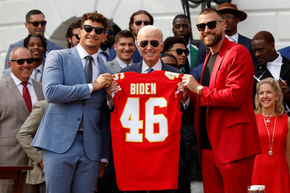 kansas city chiefs quarterback patrick mahomes and tight end travis kelce present us president joe biden with a personalized jersey during the teams visit to the white house to celebrate their championship season and victory in super bowl lvii, in washington, us, june 5, 2023 reutersevelyn hockstein