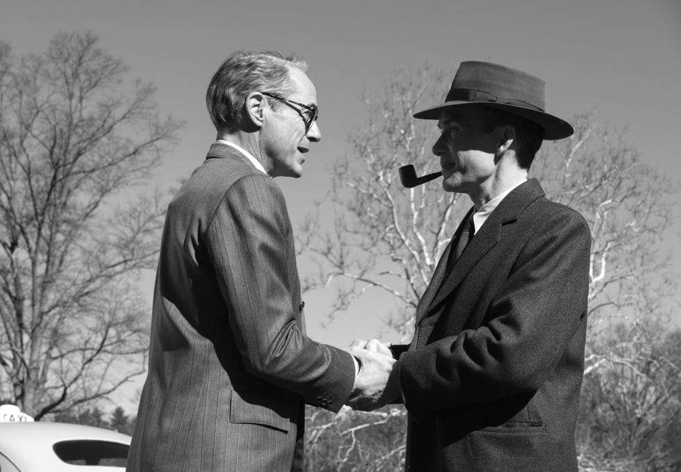 a couple of men in suits