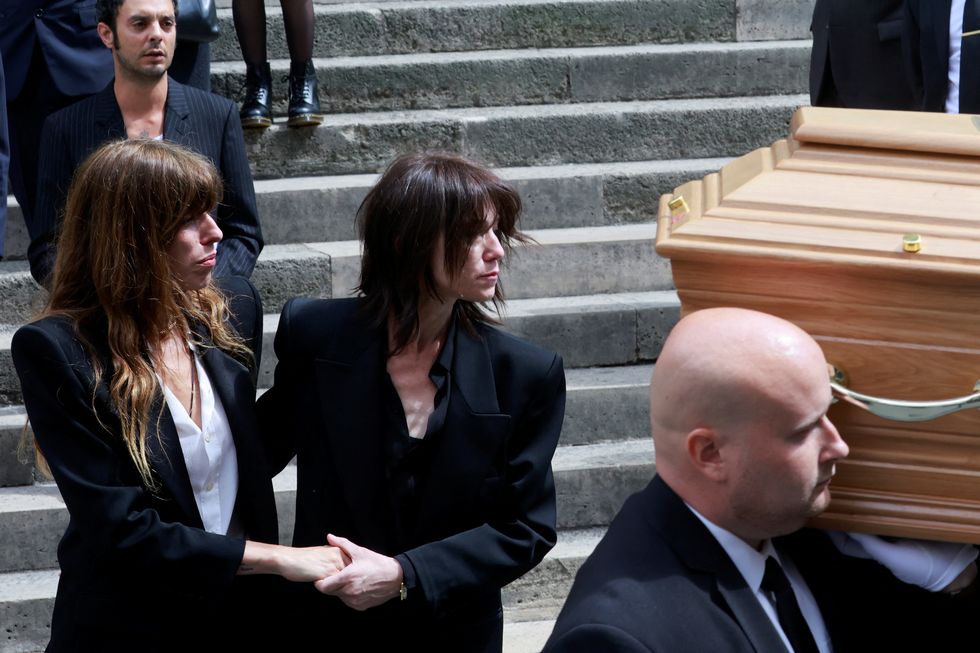 charlotte gainsbourg and lou doillon follow the coffin of their mother, late singer, actress and muse jane birkin, as they leave with kate barrys son roman de kermadec after the funeral ceremony at the church of saint roch in paris, france, july 24, 2023 reuterspascal rossignol