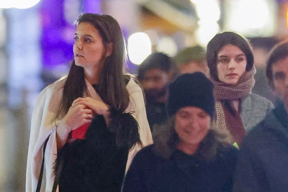 12182023 katie holmes and daughter suri cruise step out together in new york city the 45 year old american actress wore a long black dress under a white shawl and white boots salestheimagedirectcom please bylinetheimagedirectcom