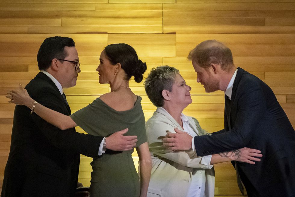 squamish nation councillor wilson williams, left meghan markle chief of the tsleil waututh nation, jen thomas and prince harry exchange greetings after being given blankets during the one year to go invictus games dinner in vancouver, british columbia, friday, feb 16, 2024 ethan cairnsthe canadian press via ap