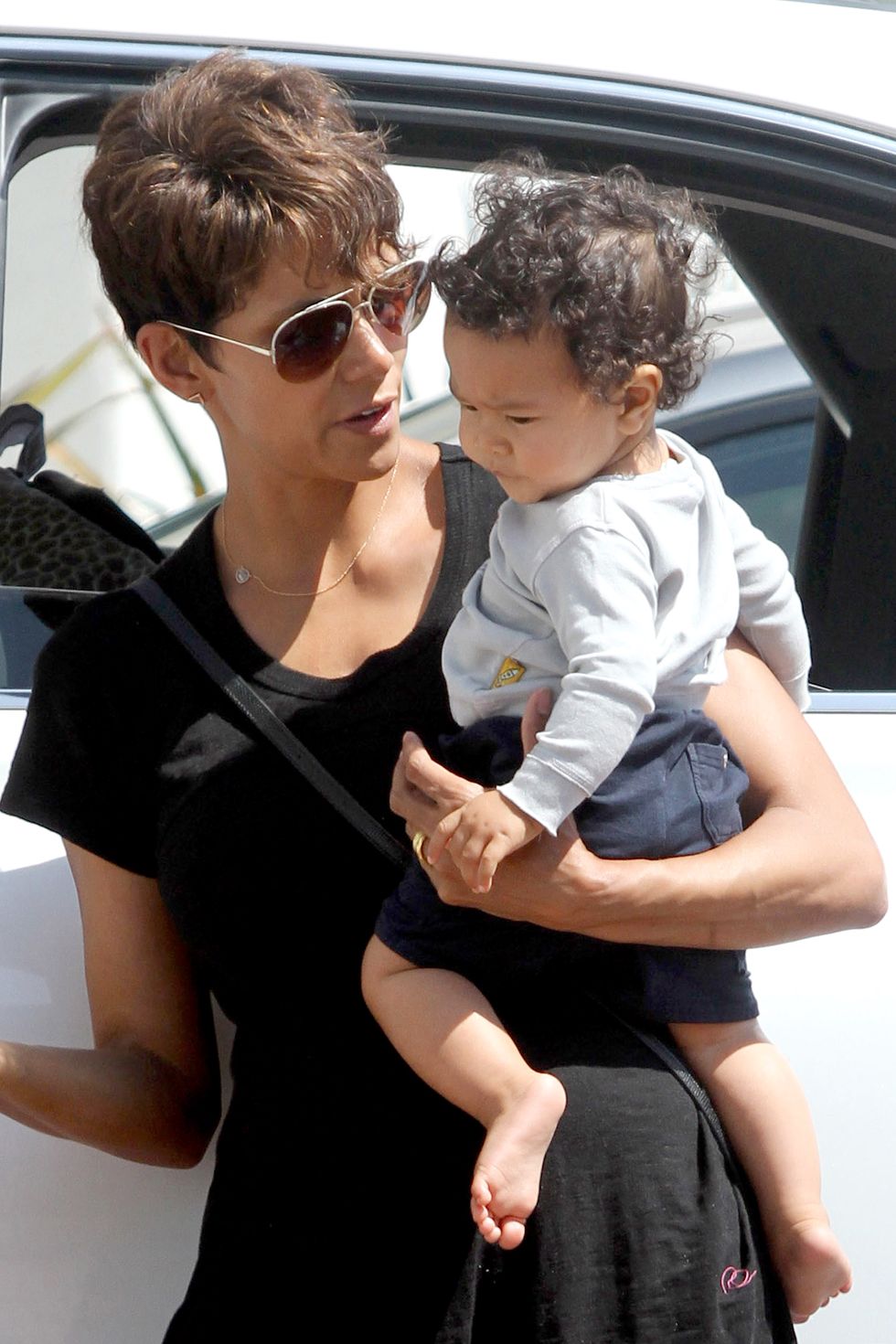 exclusive shot on 7514 los angeles, ca   halle berry steps out with her 9 month old son, maceo this afternoon for some mother son time  the actress carried her little boy in one arm while holding a giraffe toy in hand  it looks like maceo wanted his favorite toy had his eyes on it the whole time  halle was dressed for the warm weather wearing a black high low dress, which revealed what may possibly a baby bump  could halle be pregnant with her third child akm gsi          july 5, 2014to license these photos, please contact steve ginsburg310 505 8447323 423 9397steveakmgsicomsalesakmgsicomormaria buda917 242 1505mbudaakmgsicomginsburgspalyincgmailcom