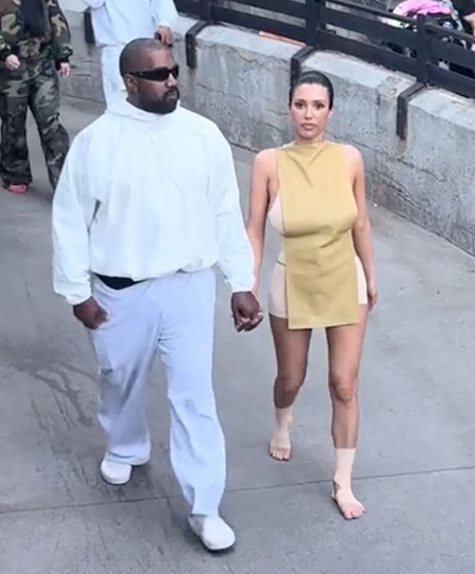 kanye west’s wife bianca censori goes shoeless with bandaged feet on a visit to disneyland, the attention grabbing couple were surprisingly low key at the theme park in anaheim, california on tuesday as bianca wore a more modest outfit than her usual skimpy ensembles, but she did show off her feet, while kanye swapped his trademark all black outfits for an all white look, byline jacemlifestylogytmxmega 16 apr 2024 pictured kanye west’s wife bianca censori goes shoeless with bandages on her feet during a visit to disneyland in anaheim, ca on april 16 byline jacemlifestylogytmxmega photo credit jacemlifestylogytmxmega themegaagencycom 1 888 505 6342