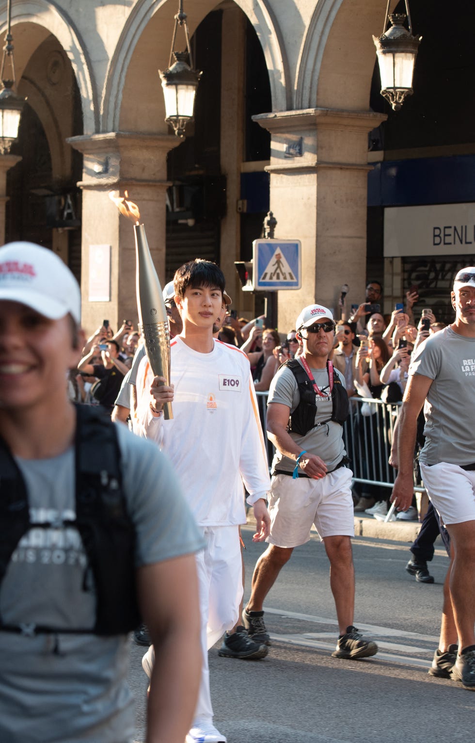 olympic torch flame kim seok jin, a member of south korean band bts on the rue de rivoli near louvre museum during the olympic torch relay in paris on july 14, 2024 photo by florian poitoutabacapresscom