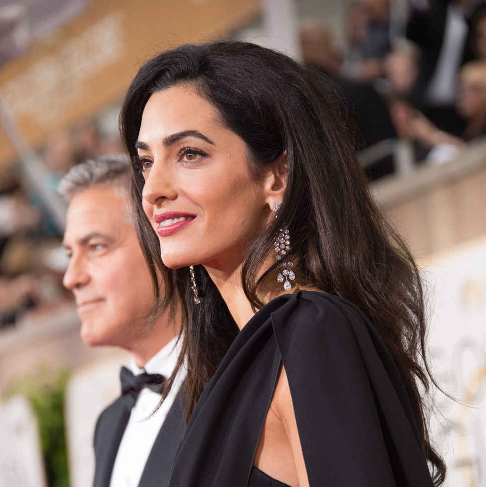 george clooney left and amal clooney attend the 72nd annual golden globe awards at the beverly hilton in beverly hills, ca on sunday, january 11, 2015