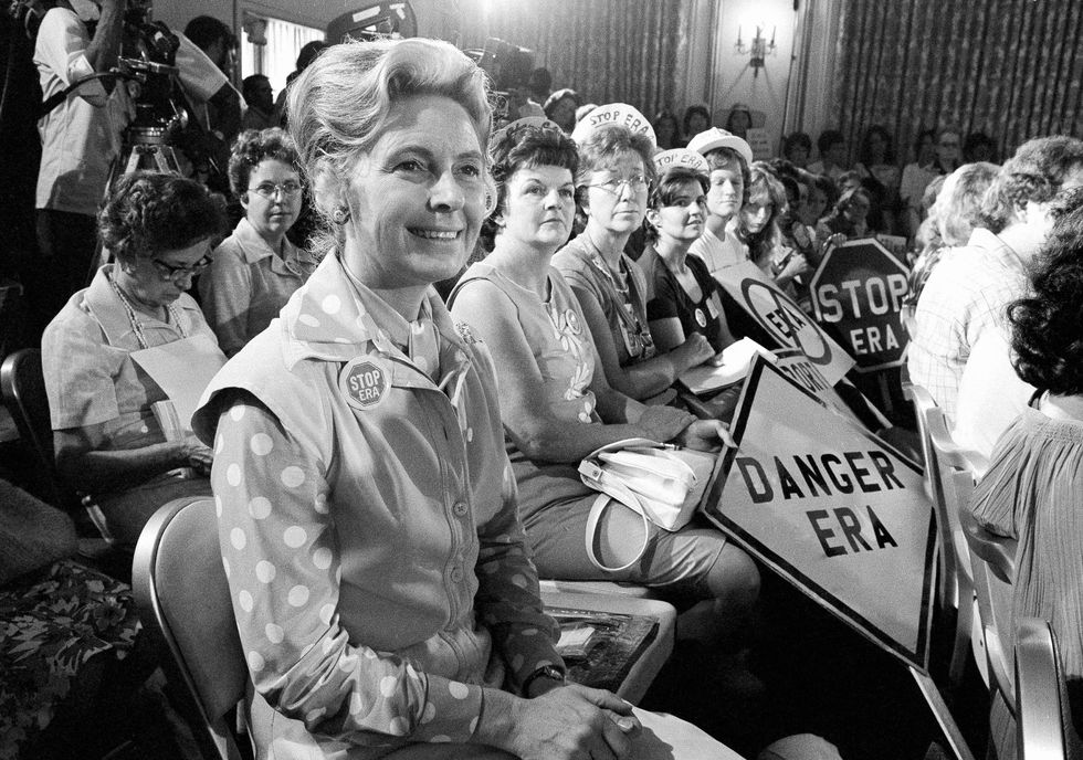 advance for use monday, june 20, 2016 and thereafter  file   in this aug 10, 1976 file photo, women opposed to the equal rights amendment sit with phyllis schlafly, foreground, national chairman of stop era, at hearing of republican platform subcommittee on human rights in kansas city, mo one of the leading opponents of the era during the 1970s, schlafly, a conservative illinois lawyer, is credited with helping mobilize public opinion against the amendment in some of the states that did not ratify it ap photofile