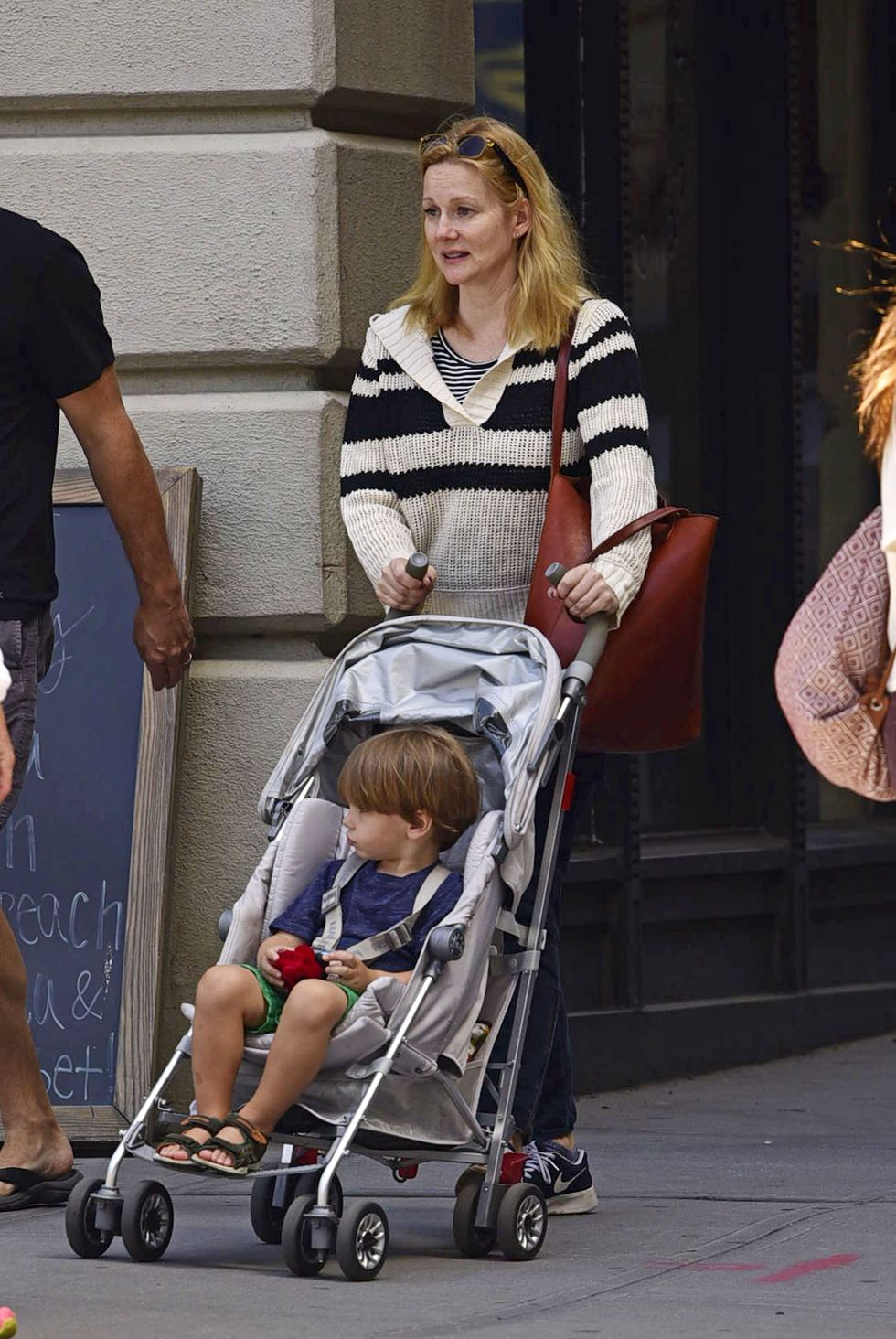 exclusive laura linney and husband marc schauer seen out with their son bennett schauer in brooklyn, new york today the 52 year old american actress and her real estate agent husband were dressed for the beautiful fall like temps in the city this weekendplease bylinetheimagedirectcom