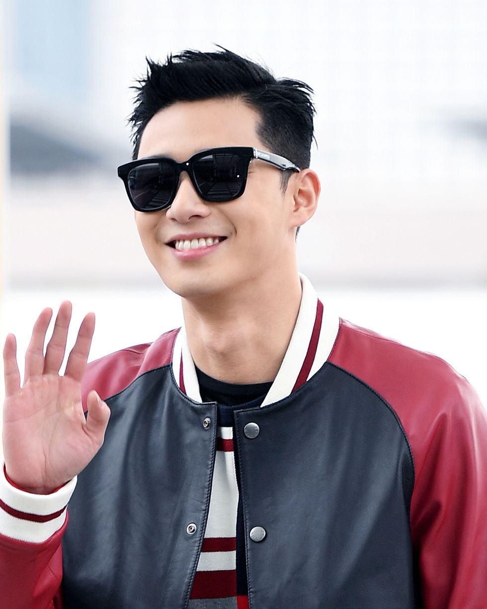 park seojun poses for pictures after he arrived at incheon international airport on february 8th in incheon, south korea photoosen