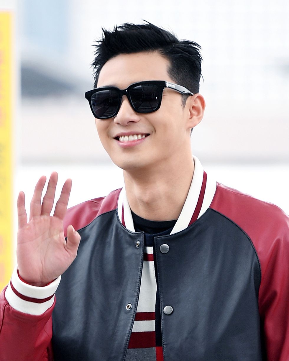 park seojun poses for pictures after he arrived at incheon international airport on february 8th in incheon, south korea photoosen