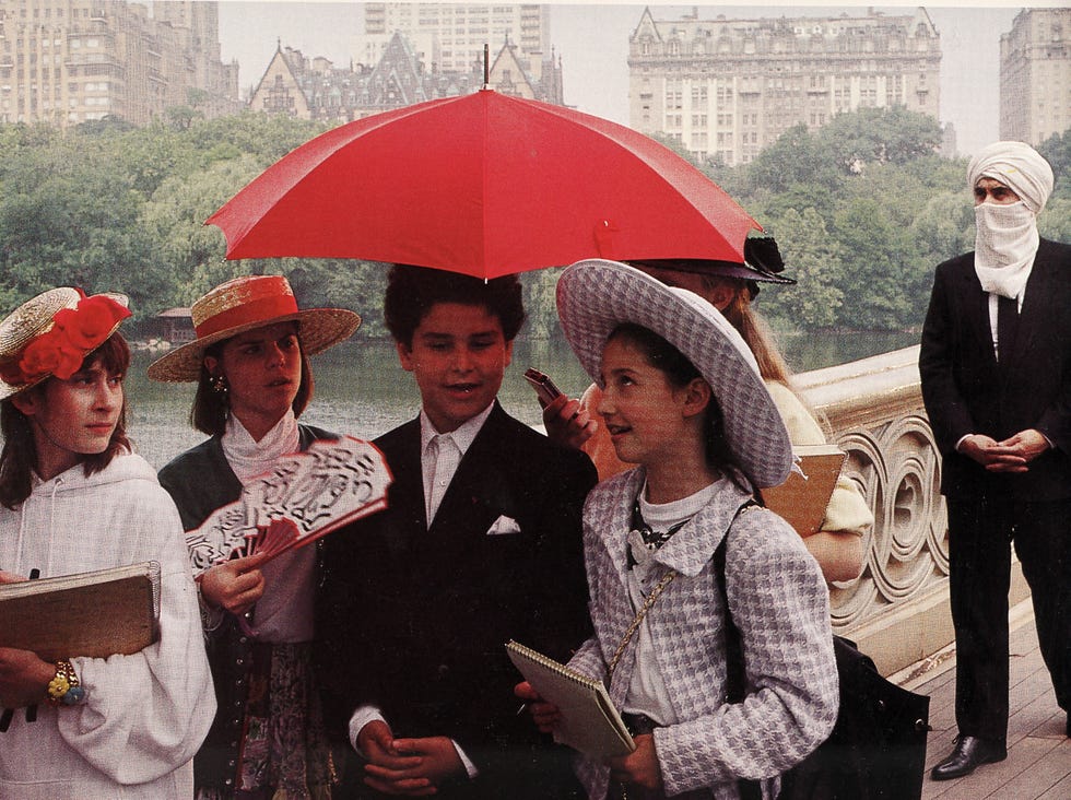 People, Red, Umbrella, Fashion accessory, Event, Headgear, Rain, Tourism, Smile, 