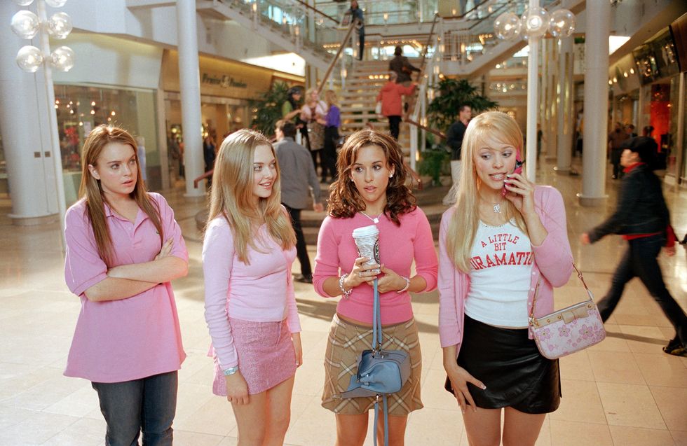 a group of girls in pink shirts