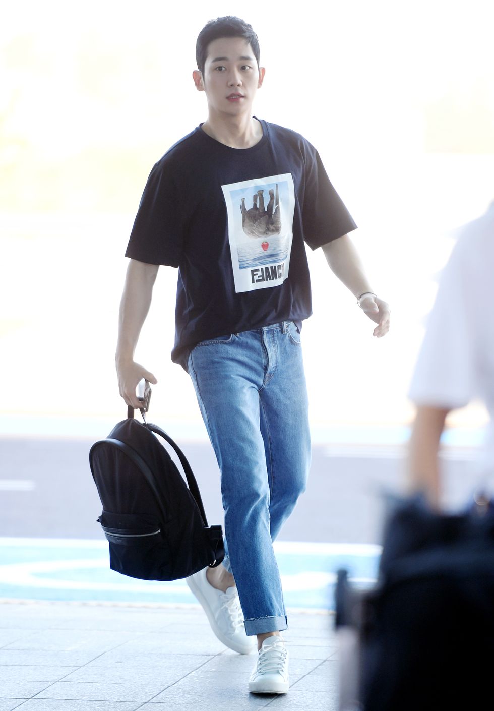 jung hae in poses for pictures after he arrived at incheon international airport on june 1st in incheon, south korea photoosen