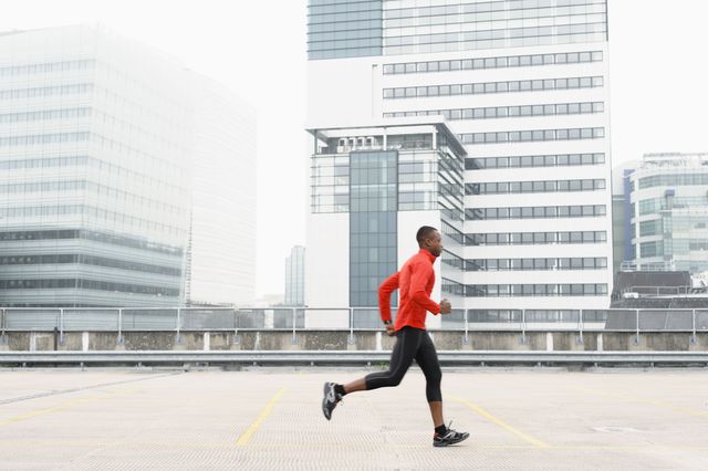 African American runner jogging in city