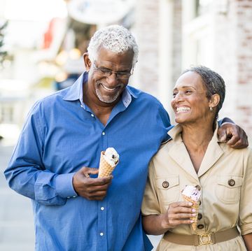 african american senior couple on the town with ice cream