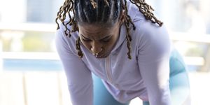 african american woman sweating after hard workout