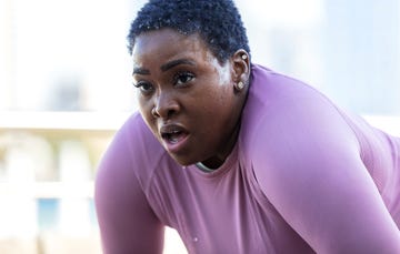 african american woman sweating after hard workout