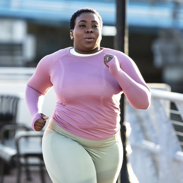 african american woman with large build, running in city