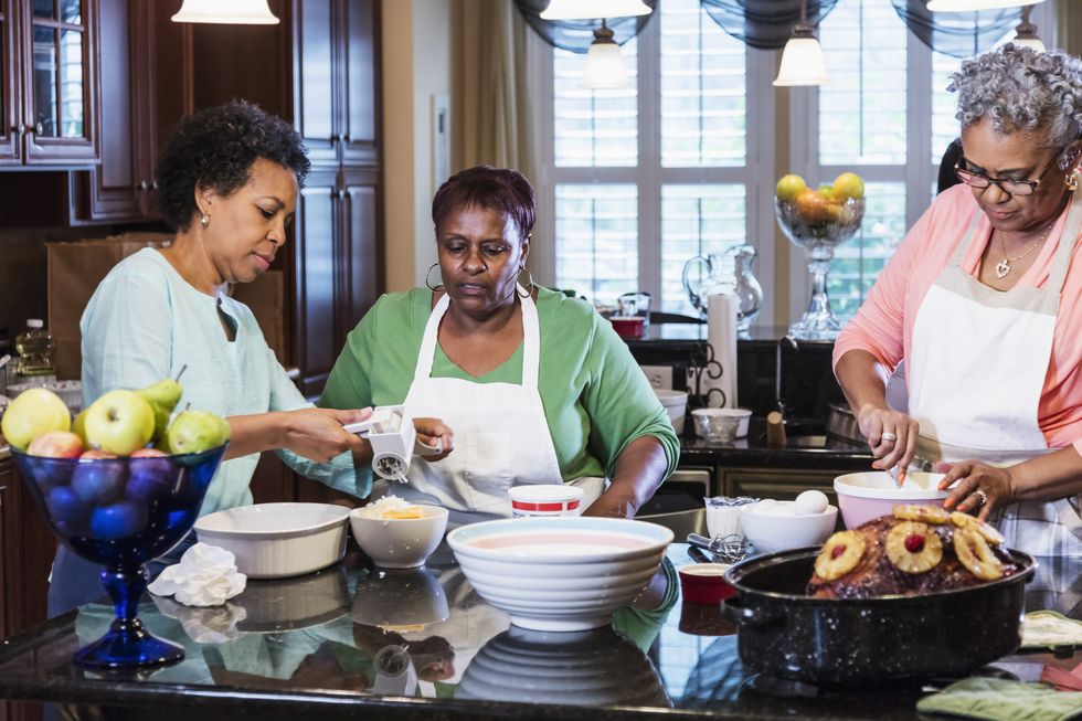 African-American women in kitchen cooking