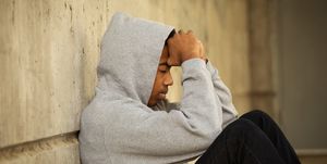African American young teen feeling depressed.