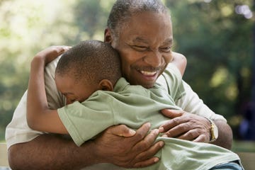 grandfather and grandson hugging