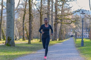 african woman jogging during her daily workout