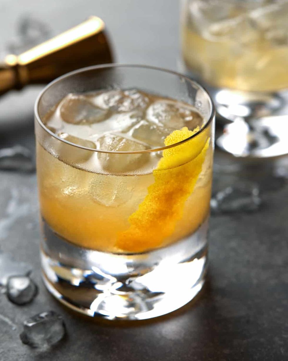 ginger gold rush cocktail in glass with ice