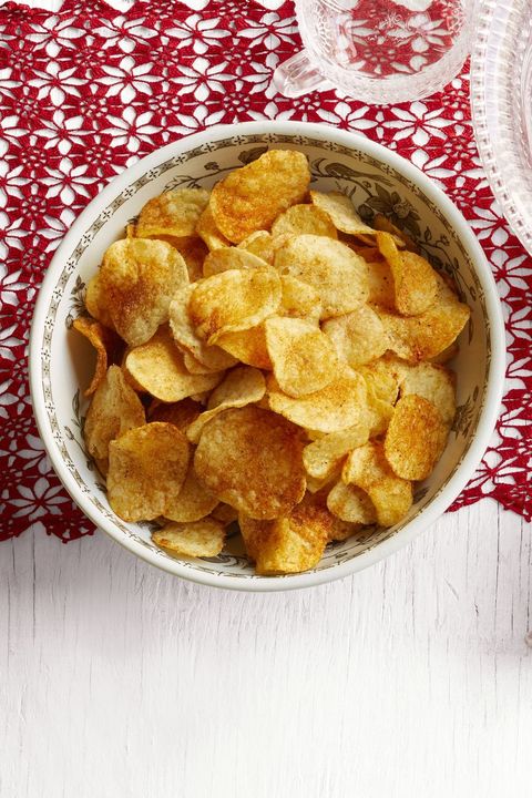 spiced up potato chips on red fabric
