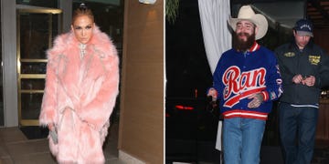 two individuals dressed in distinctive outfits in an urban setting