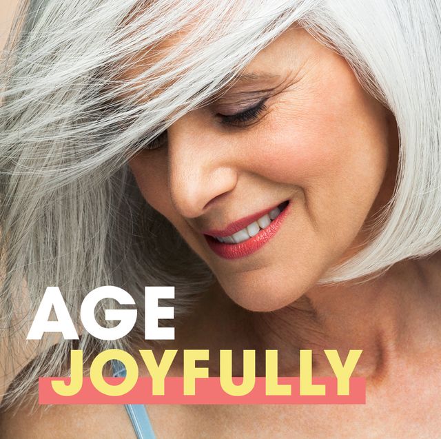 embrace the beauty of aging with our guide to aging joyfully woman gray hair smiling looking down