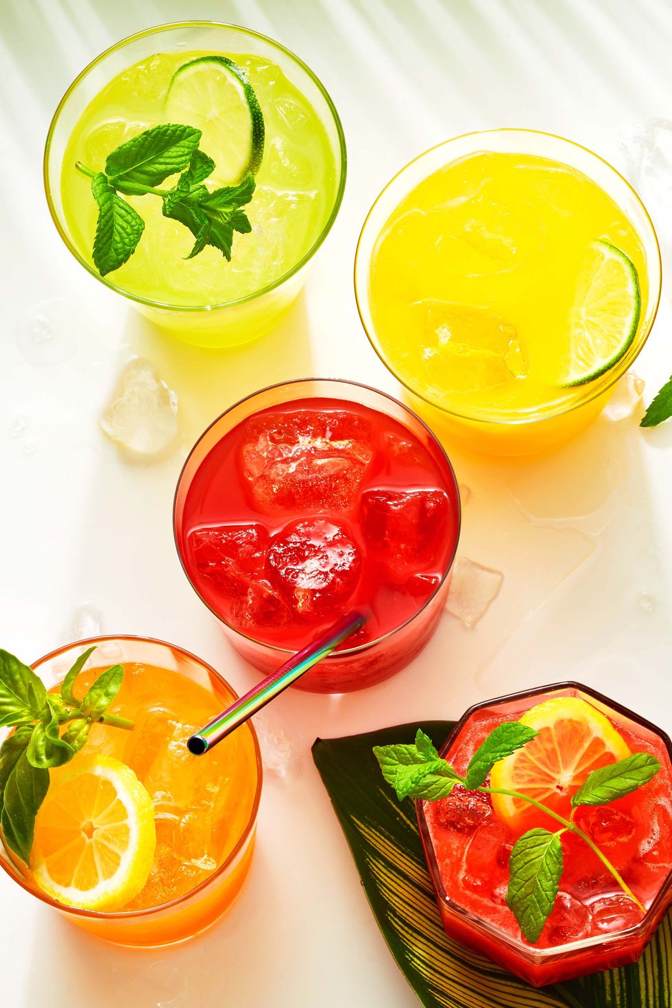 green, red, and yellow glasses of agua frescas
