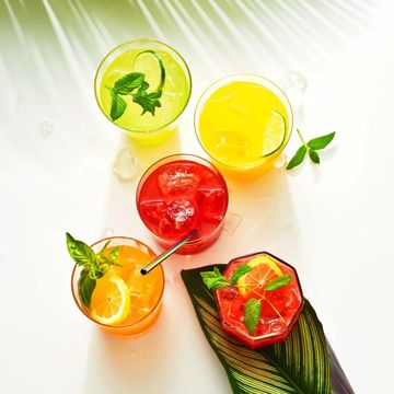 multiple glasses of red, yellow and orange agua frescas