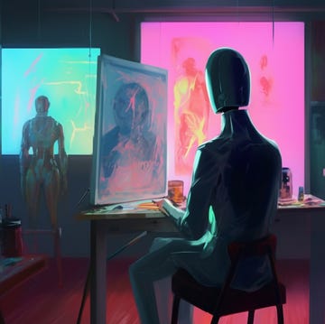 seated robot artist painting on digital screen