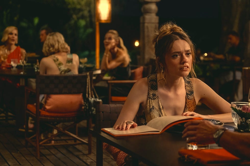 a dining scene in an outdoor setting with customers engaged in conversation