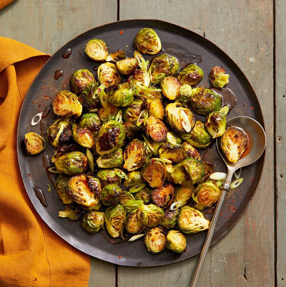 crispy brussels sprouts on a black plate