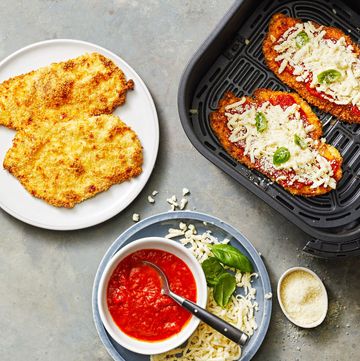chicken parmesan cutlets with mozzarella cheese on top