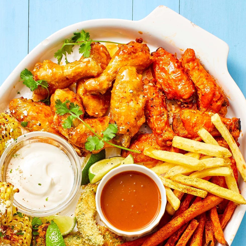 air fryer chicken wings with sides of dipping sauce