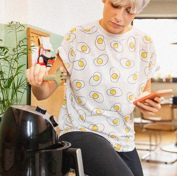 person cooking with air fryer