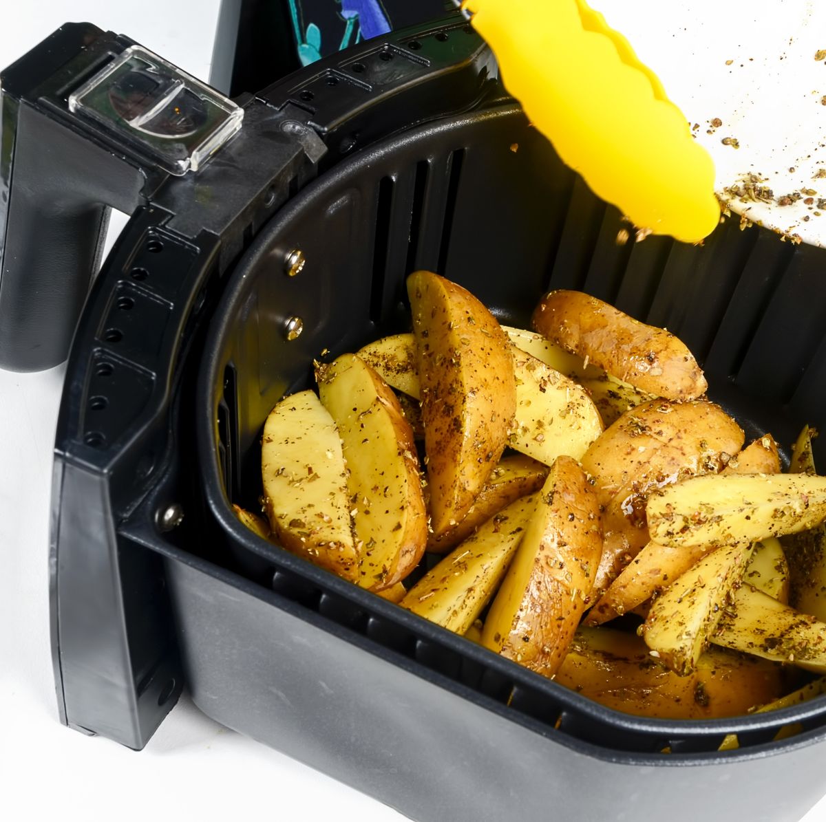 https://hips.hearstapps.com/hmg-prod/images/air-fryer-grill-potato-at-home-isolated-on-white-royalty-free-image-1640714864.jpg?crop=0.665xw:1.00xh;0.0385xw,0&resize=1200:*