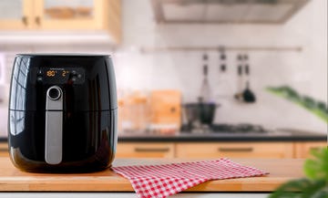 air fryer machine cooking potato fried in kitchen