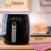 air fryer machine cooking potato fried in kitchen lifestyle of new normal cooking