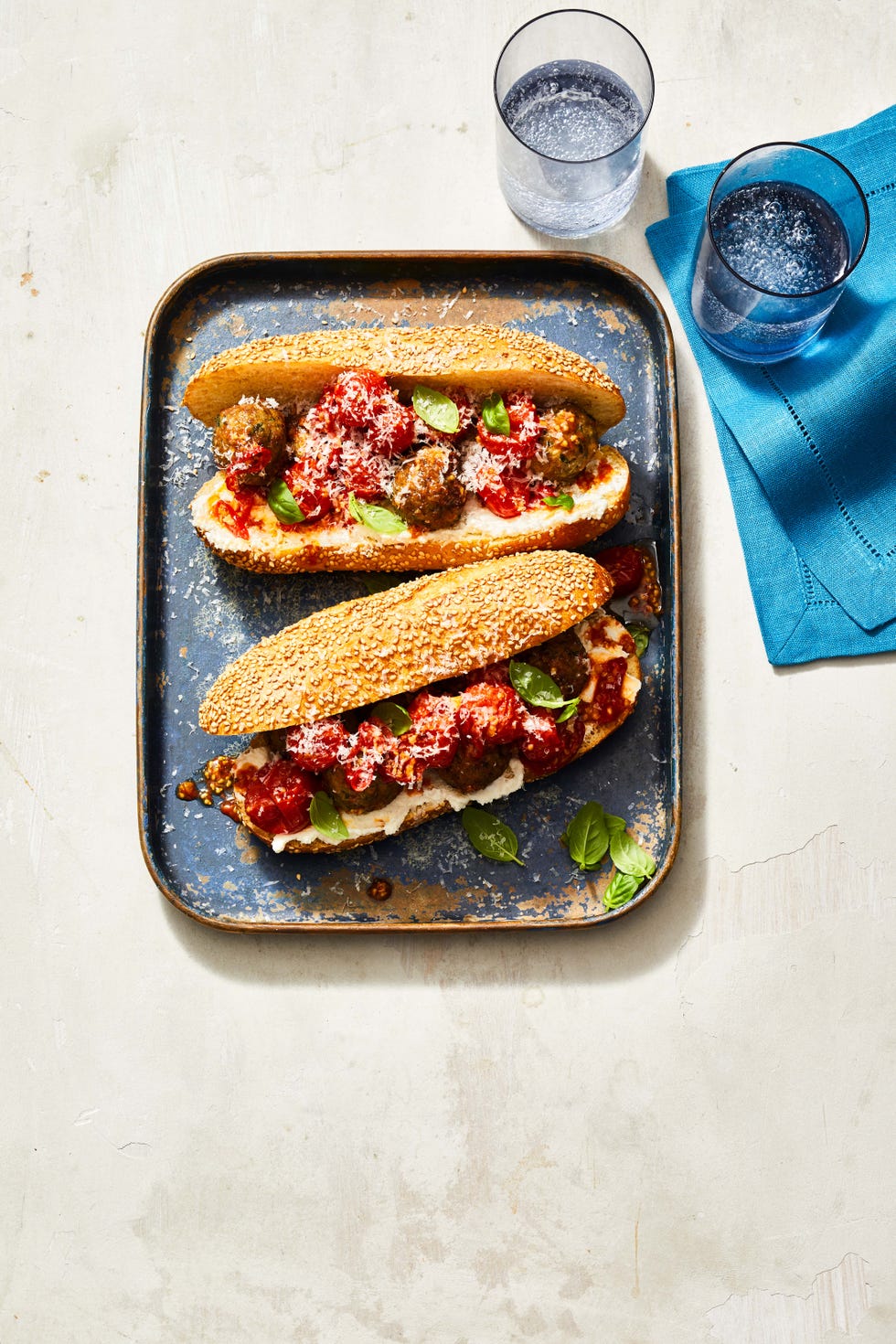 two air fryer meatball subs on a plater