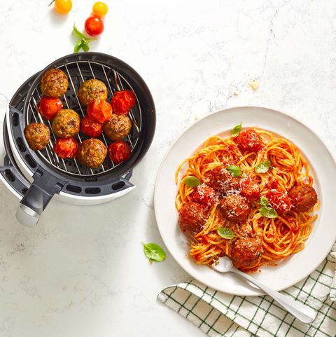 spaghetti and air fryer meatballs on a white marble surface