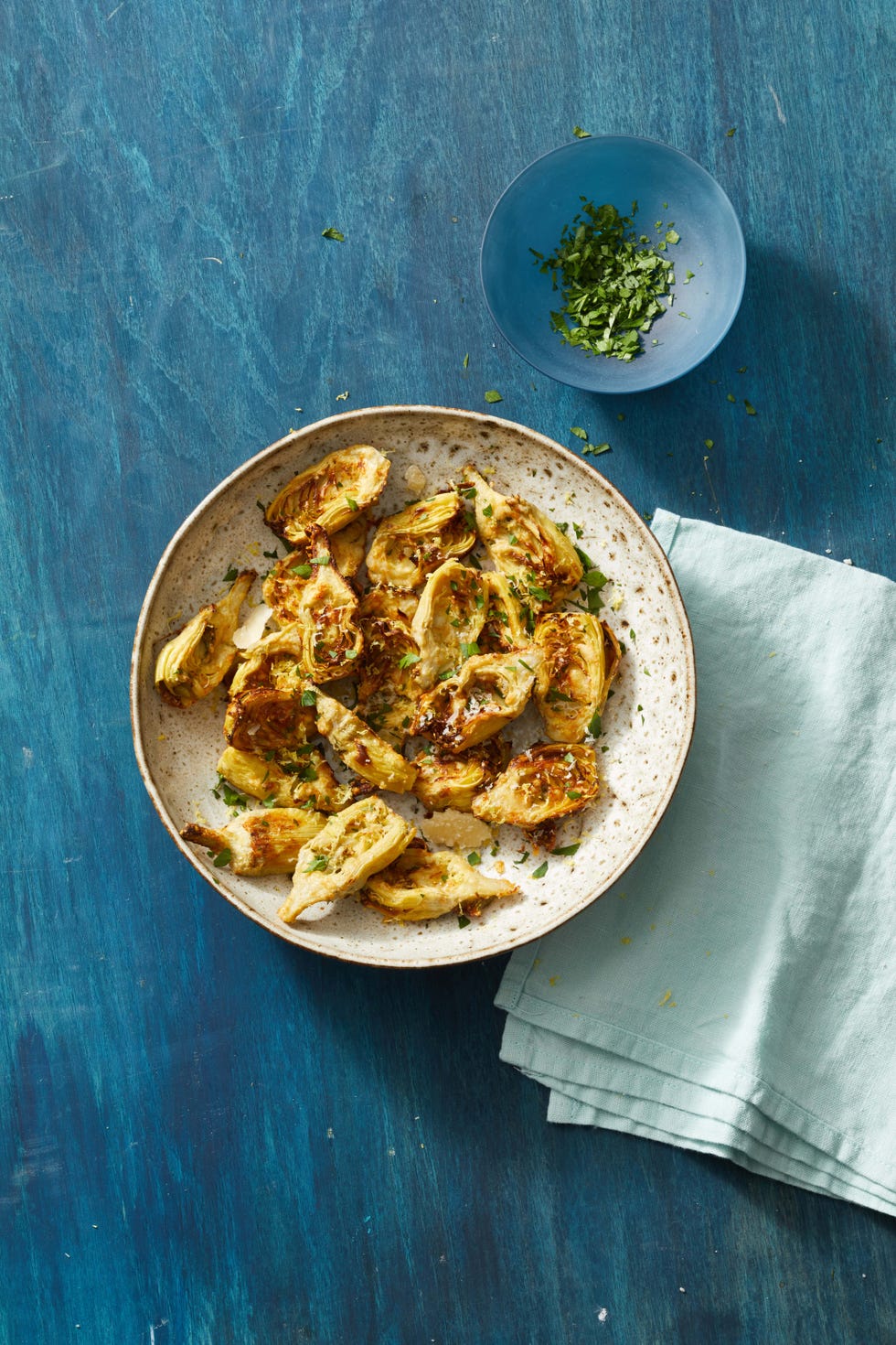 parmesan thyme artichokes on a plate