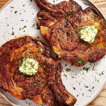 steak on a plate with butter and herbs