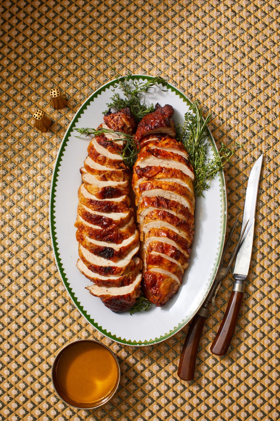 sliced air fryer turkey breast with gravy on a platter
